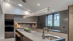 Modern kitchen remodel with a faucet in a kitchen island