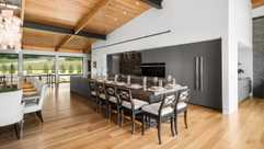 Serene modern kitchen with granite kitchen island and integrated appliances