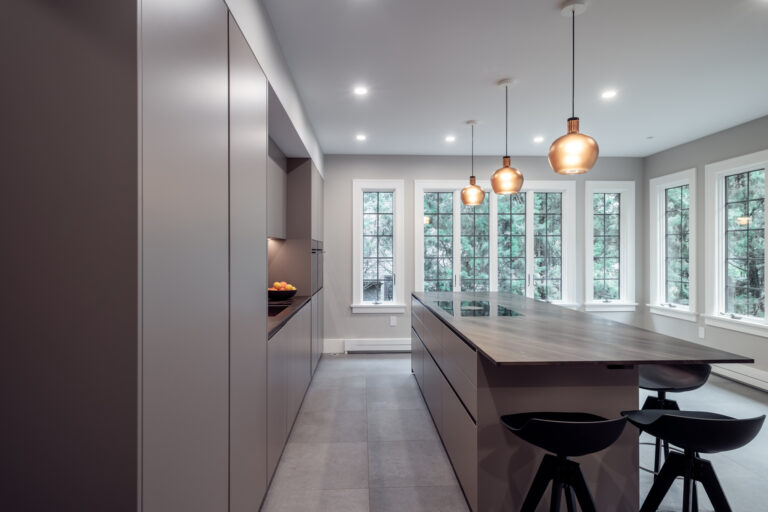 Modern kitchen in Clifton's Gaslight District preserves teh original window casings. 